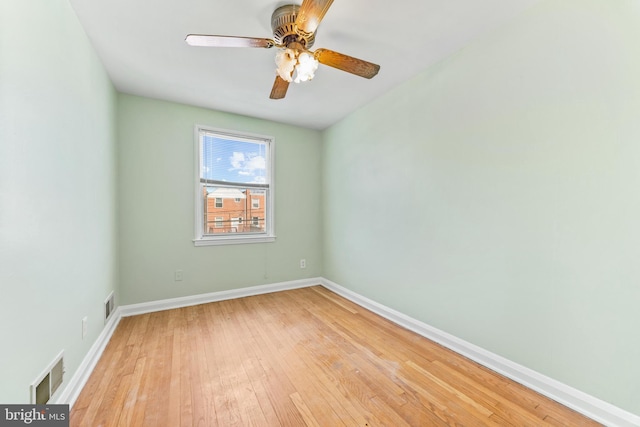 spare room featuring ceiling fan and light hardwood / wood-style flooring