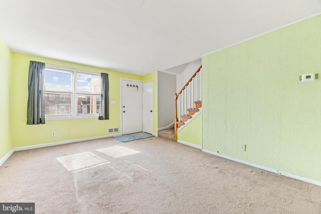 foyer entrance with carpet