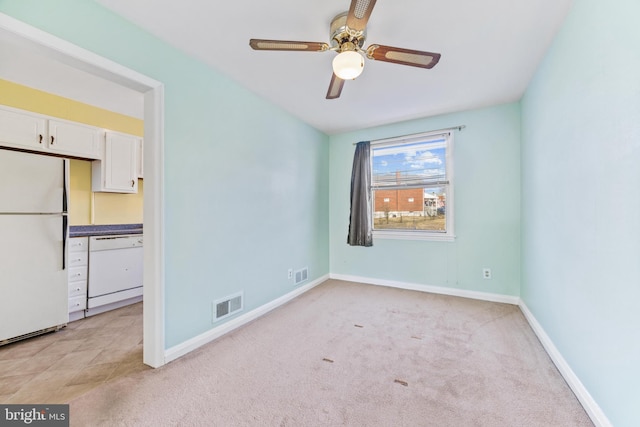 carpeted empty room with ceiling fan