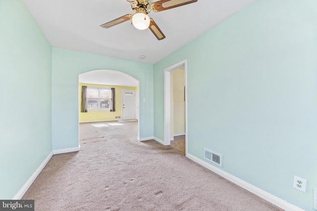 carpeted empty room with ceiling fan