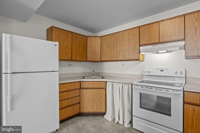 kitchen featuring sink and white appliances