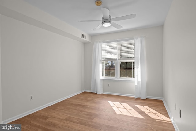 spare room featuring ceiling fan and light hardwood / wood-style floors