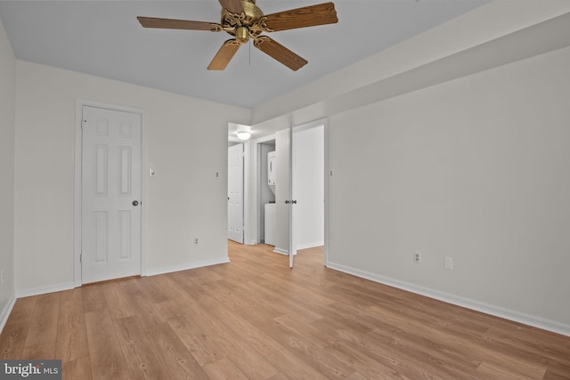 unfurnished room featuring ceiling fan and light wood-type flooring