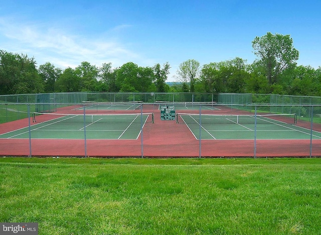 view of sport court featuring a yard