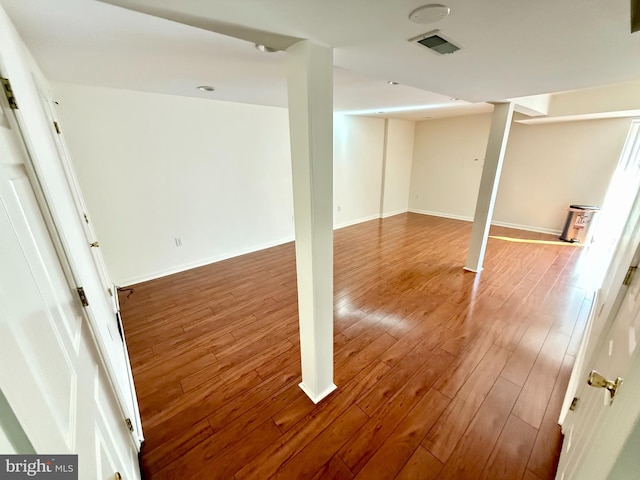 basement featuring wood-type flooring