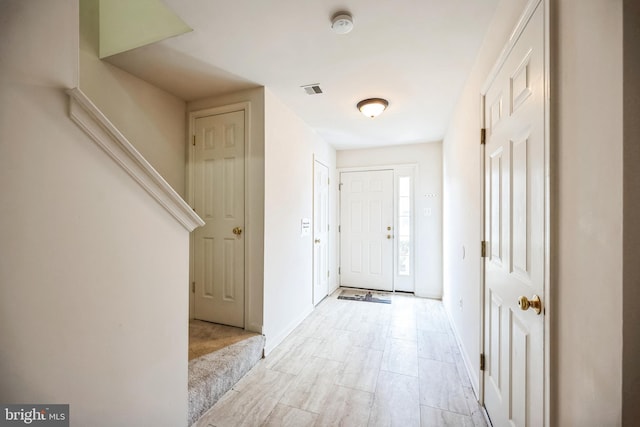 foyer featuring visible vents