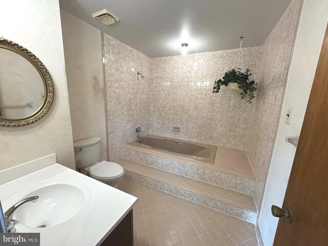 full bath featuring toilet, visible vents, a bathtub, and vanity