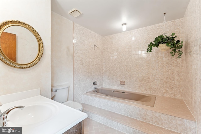 full bathroom featuring toilet, a garden tub, and a sink