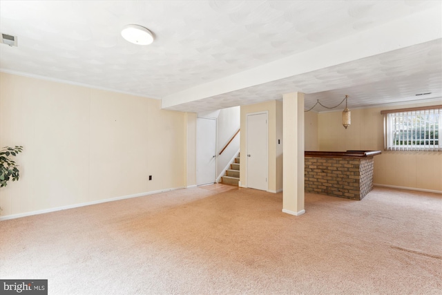 basement featuring carpet, stairway, and baseboards