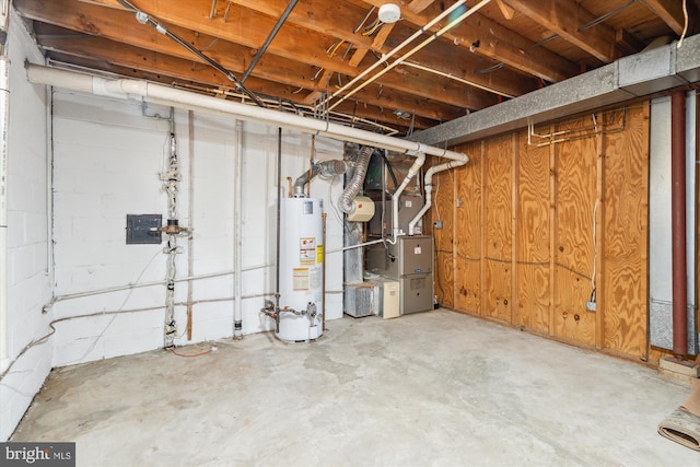 unfinished basement with water heater and heating unit