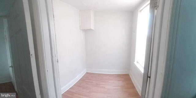 interior space with plenty of natural light and hardwood / wood-style floors