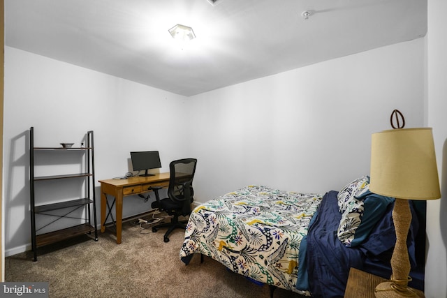 bedroom with carpet and baseboards