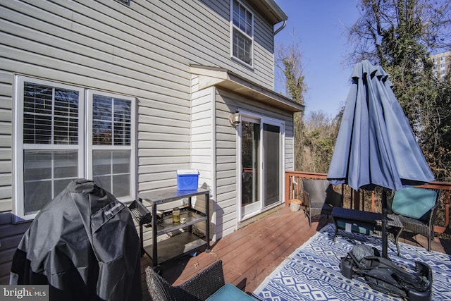 wooden terrace with area for grilling