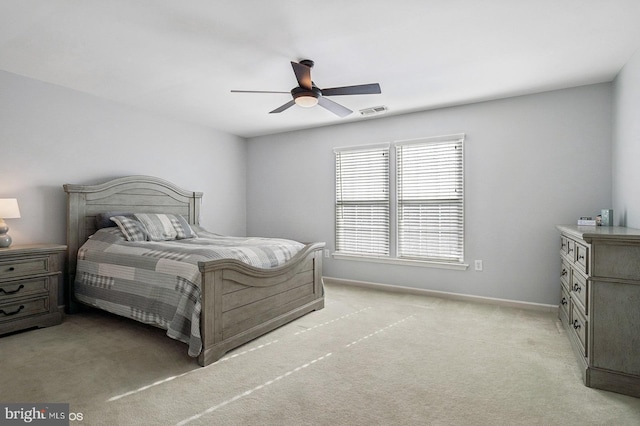 bedroom with light colored carpet and ceiling fan