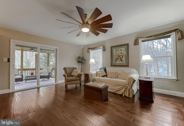 sitting room featuring dark hardwood / wood-style floors and ceiling fan