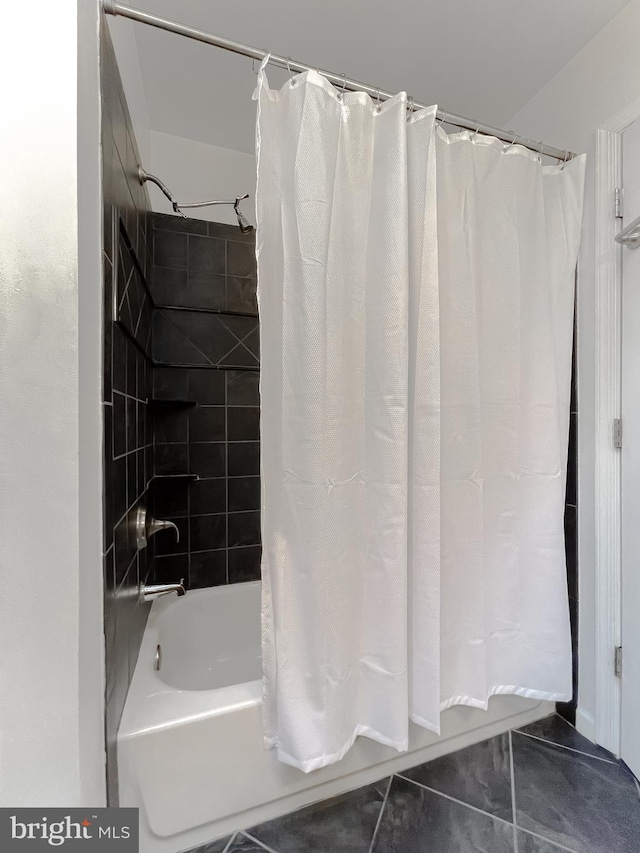 bathroom with shower / tub combo with curtain