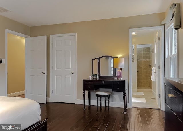 bedroom with dark hardwood / wood-style flooring