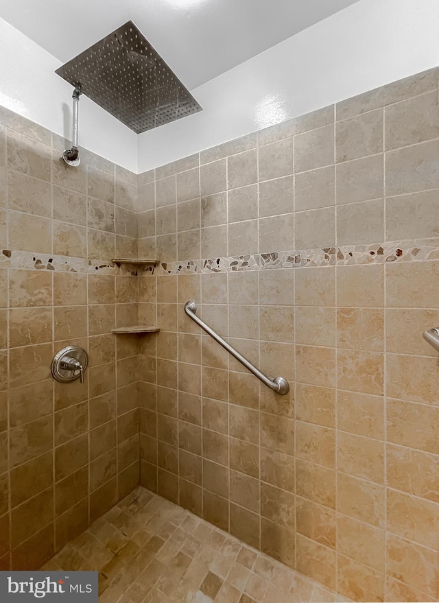 bathroom with tiled shower