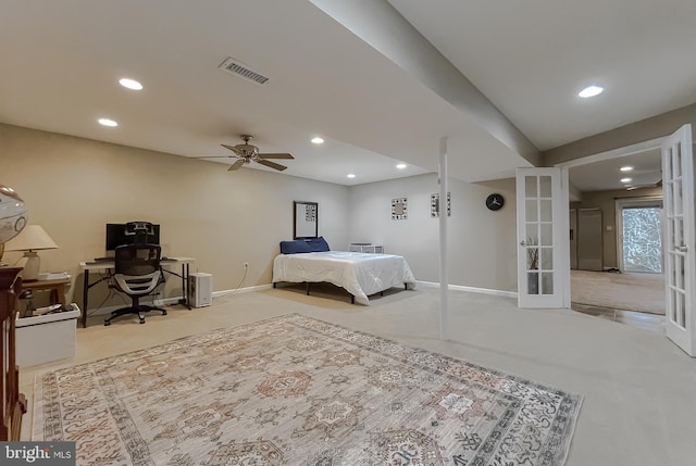 bedroom with french doors and light colored carpet