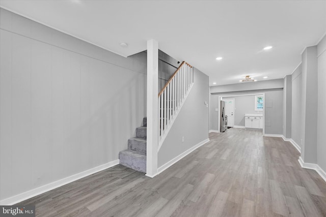 foyer entrance with light hardwood / wood-style floors