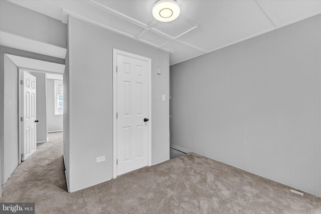 unfurnished bedroom featuring light colored carpet