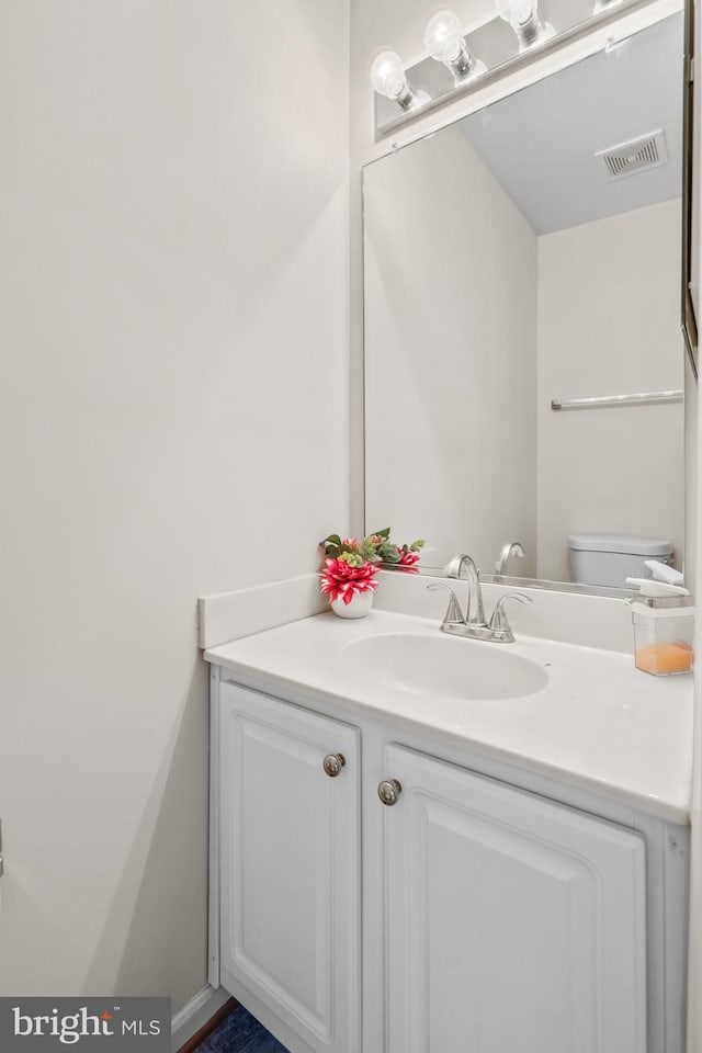 bathroom with vanity and toilet