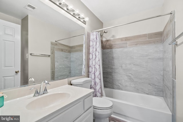 full bathroom featuring vanity, toilet, and shower / tub combo with curtain