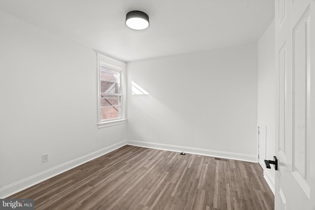 spare room featuring hardwood / wood-style floors