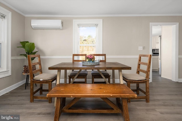 dining room featuring hardwood / wood-style floors, crown molding, and a wall mounted air conditioner