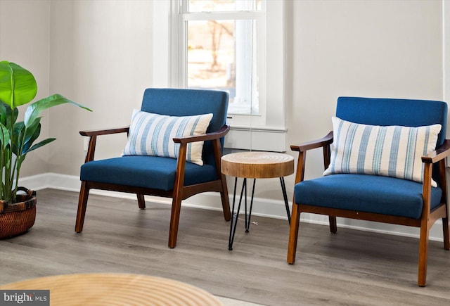 sitting room with light hardwood / wood-style floors