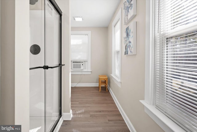 hall featuring cooling unit and wood-type flooring