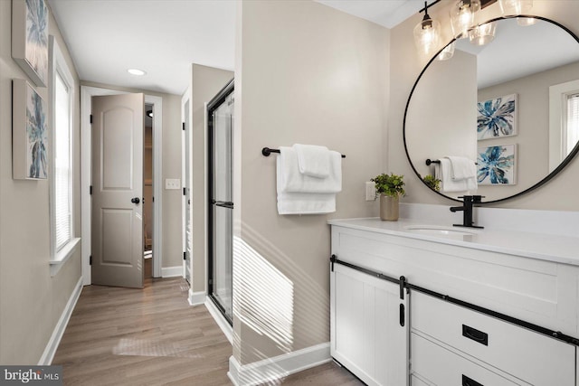 bathroom featuring vanity and hardwood / wood-style flooring