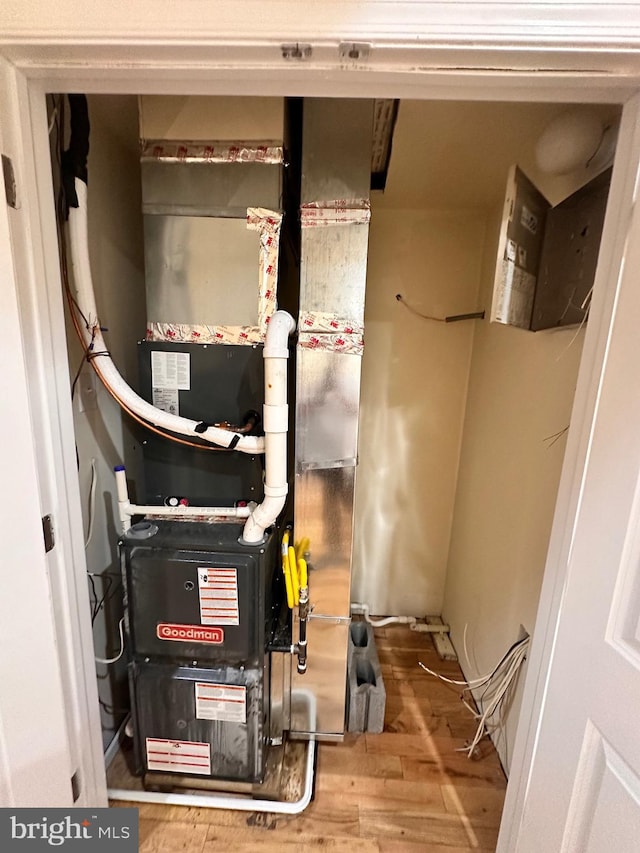 utility room with heating unit