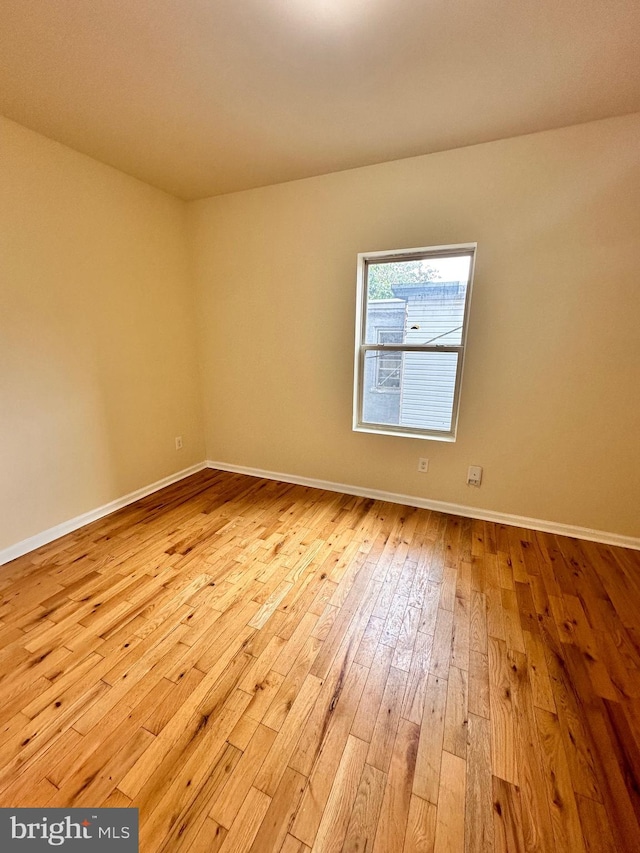 spare room with light hardwood / wood-style floors