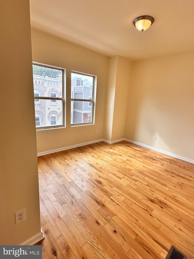 spare room with light hardwood / wood-style floors