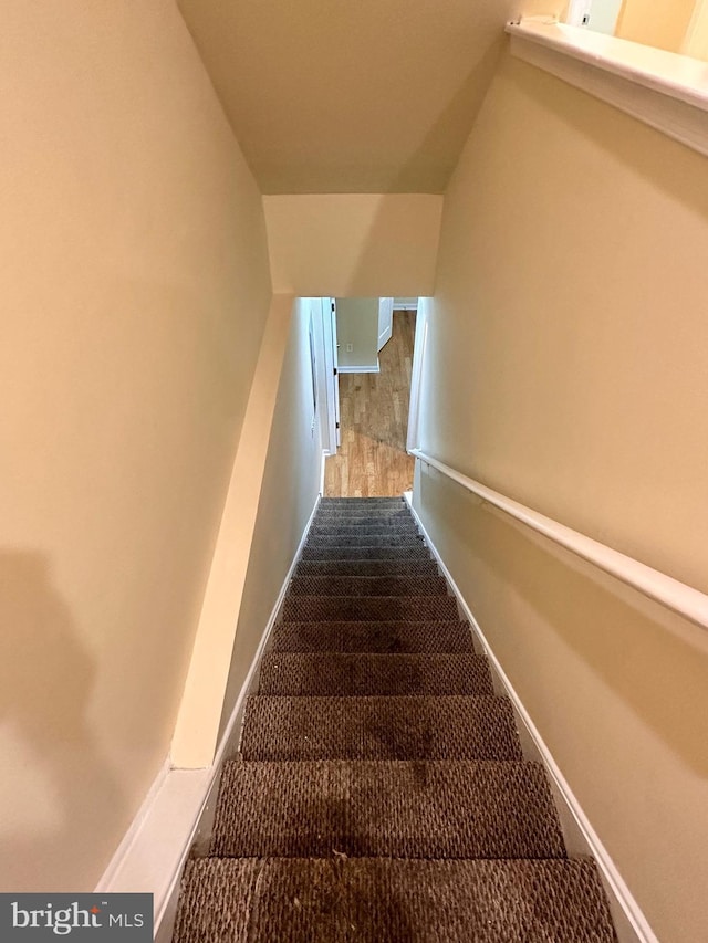 stairs featuring lofted ceiling