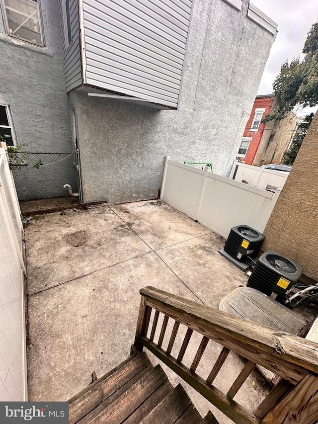 view of patio featuring central AC unit