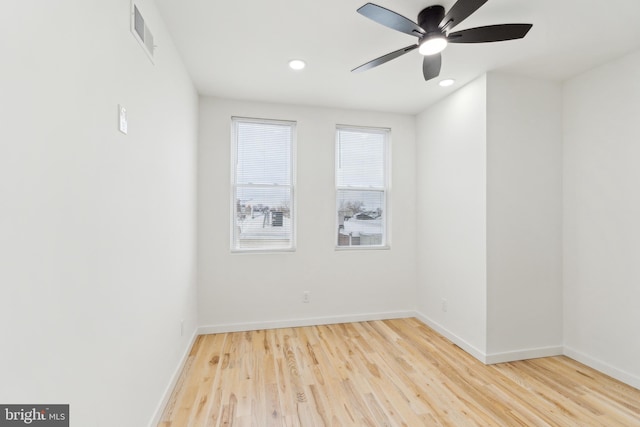 unfurnished room featuring ceiling fan and light wood-type flooring