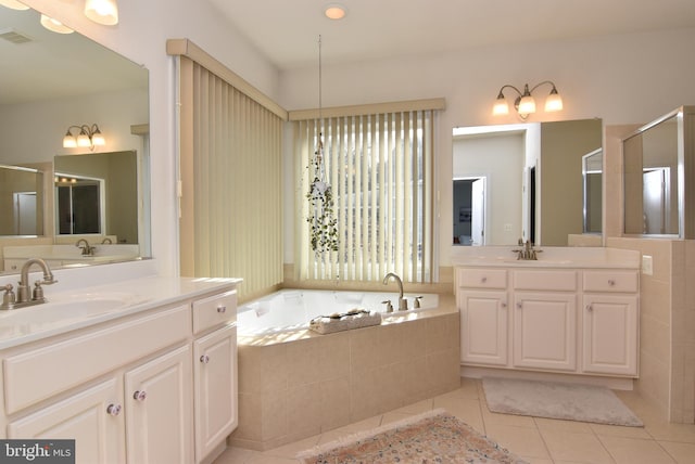 bathroom featuring tile patterned floors, separate shower and tub, and vanity