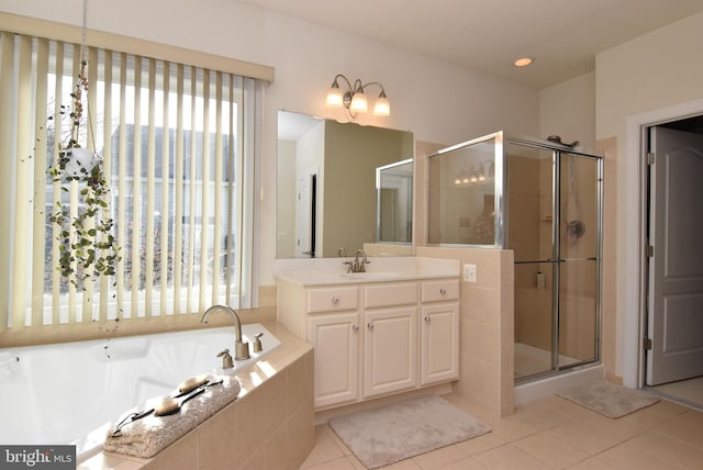 bathroom featuring vanity, separate shower and tub, and tile patterned flooring