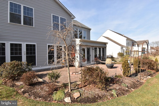 rear view of house featuring french doors and a patio area