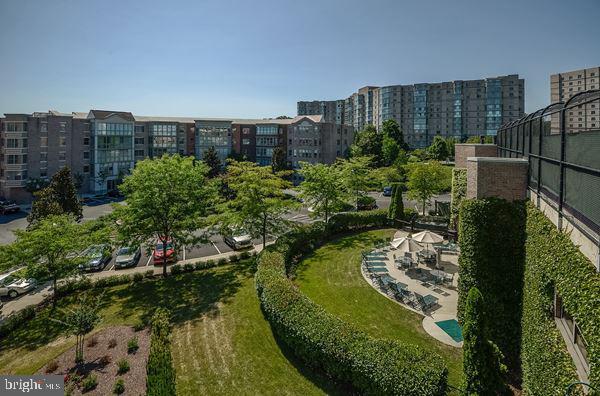 view of property's community with a yard