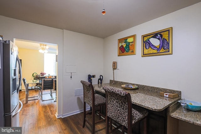 dining room with hardwood / wood-style flooring