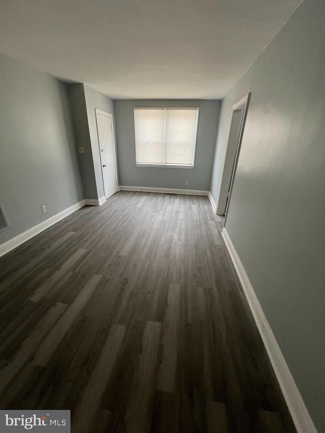 empty room featuring dark hardwood / wood-style floors