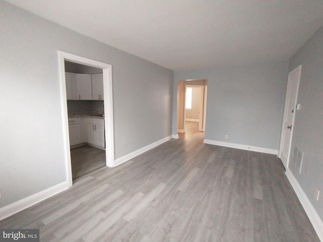 spare room featuring light hardwood / wood-style floors