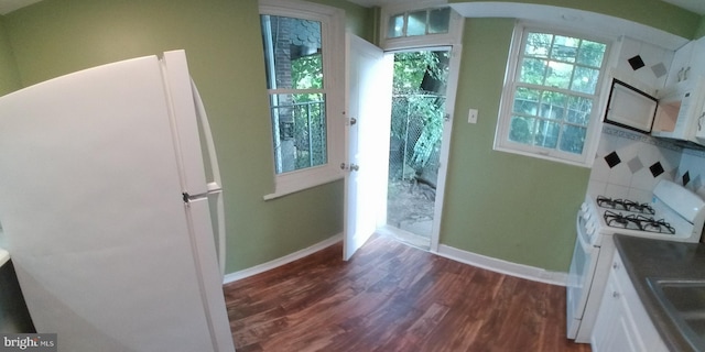 doorway featuring sink and dark wood-type flooring