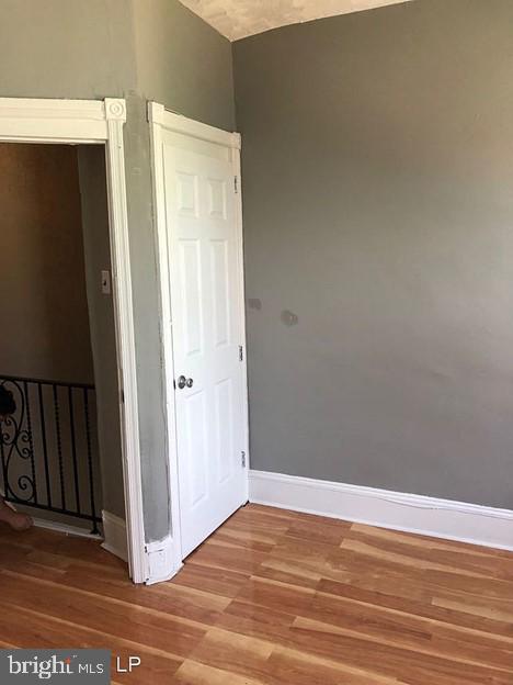 empty room featuring wood-type flooring