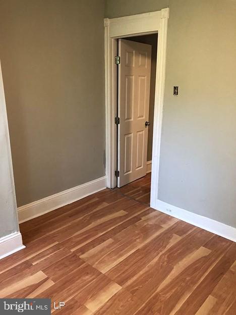 empty room featuring wood-type flooring