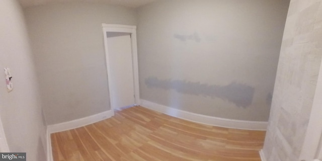 spare room with hardwood / wood-style floors