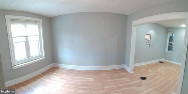 spare room with light hardwood / wood-style flooring